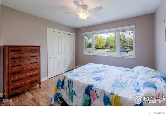 873 Cypress Dr, Boulder, CO 80303 - bedroom featuring light wood-style floors, a closet, and ceiling fan