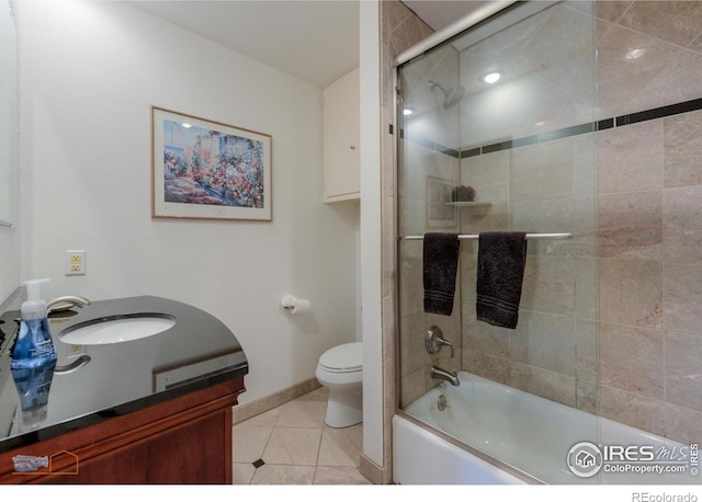 873 Cypress Dr, Boulder, CO 80303 - bathroom with vanity, enclosed tub / shower combo, and tile patterned flooring