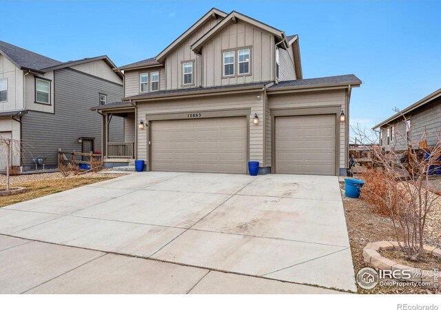 view of front of home featuring driveway, a garage, and board and batten siding