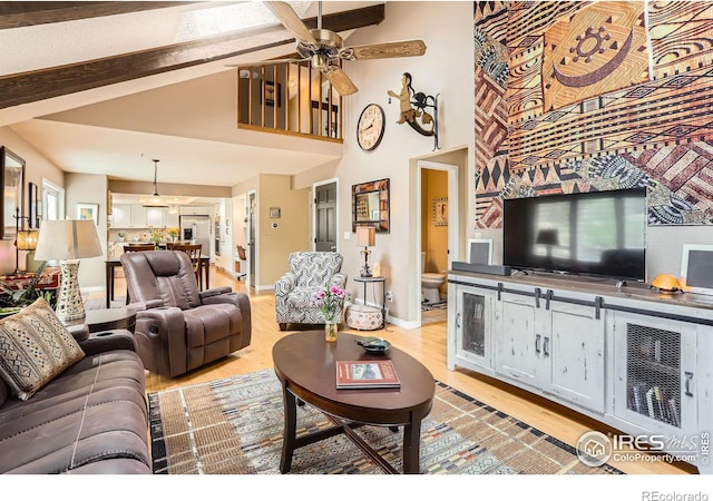 4057 Niblick Dr, Longmont, CO 80503 - living room featuring a ceiling fan, light wood-type flooring, beamed ceiling, a high ceiling, and baseboards