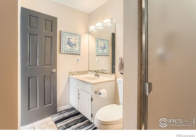 4057 Niblick Dr, Longmont, CO 80503 - full bath with toilet, vanity, and a shower with door