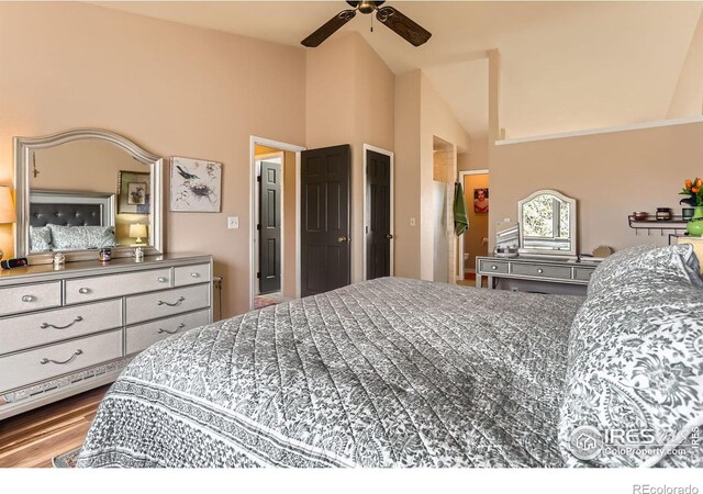 4057 Niblick Dr, Longmont, CO 80503 - bedroom with high vaulted ceiling, wood finished floors, and ceiling fan