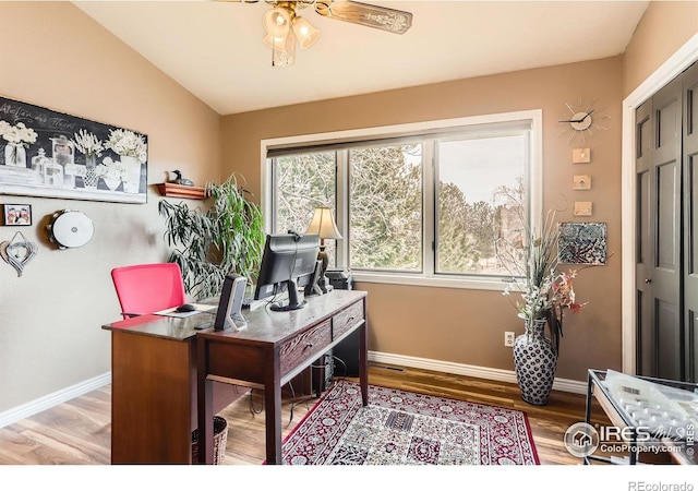 4057 Niblick Dr, Longmont, CO 80503 - office area with baseboards, wood finished floors, vaulted ceiling, and ceiling fan