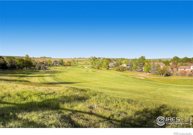 4057 Niblick Dr, Longmont, CO 80503 - view of community featuring golf course view and a lawn
