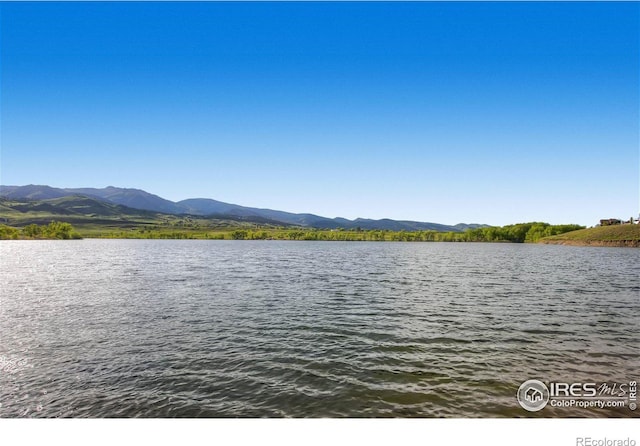 4057 Niblick Dr, Longmont, CO 80503 - water view with a mountain backdrop