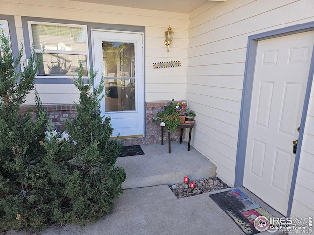929 Parker Dr, Longmont, CO 80501 - doorway to property with stone siding and covered porch