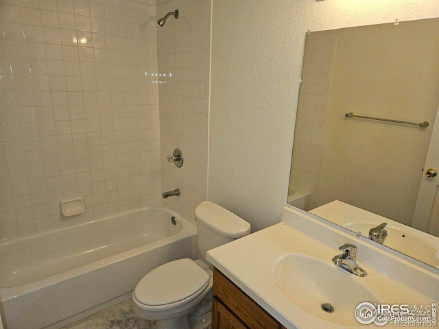 929 Parker Dr, Longmont, CO 80501 - bathroom with a textured wall, toilet, vanity, and shower / tub combination