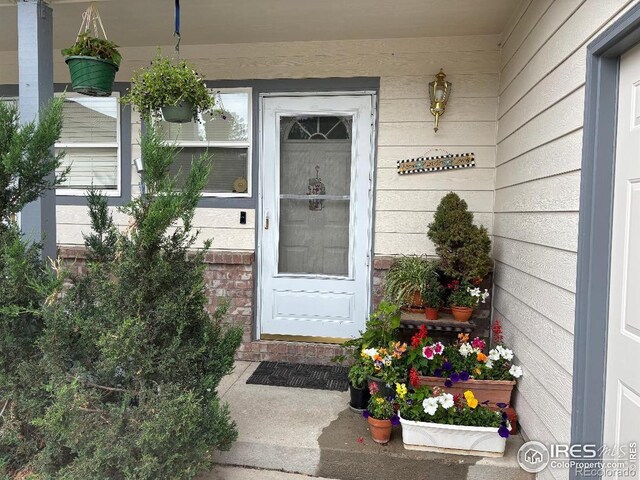929 Parker Dr, Longmont, CO 80501 - doorway to property with covered porch