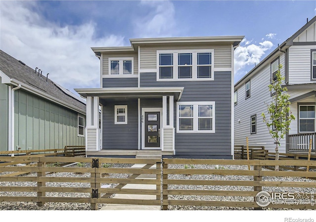 view of front of house with a porch and a fenced front yard