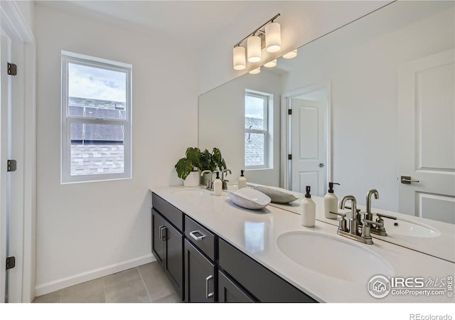 full bath with a wealth of natural light and a sink
