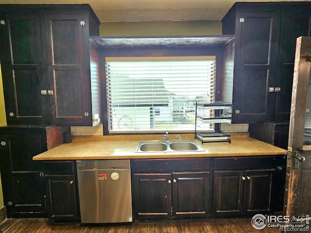 704 S 3rd Ave, Sterling, CO 80751 - kitchen featuring a sink, light countertops, stainless steel dishwasher, and a wealth of natural light