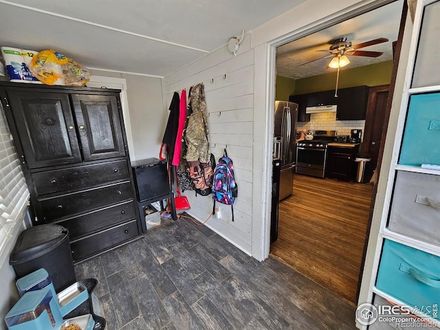704 S 3rd Ave, Sterling, CO 80751 - interior space with a ceiling fan and dark wood-type flooring
