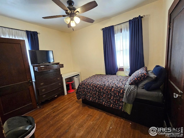 704 S 3rd Ave, Sterling, CO 80751 - bedroom with ceiling fan and hardwood / wood-style floors