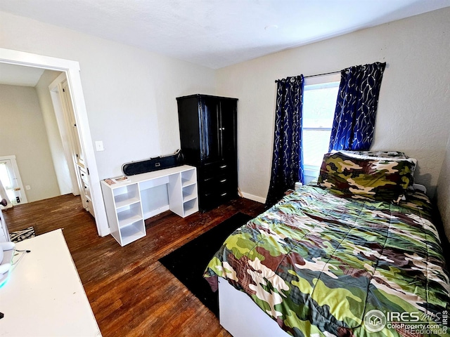 704 S 3rd Ave, Sterling, CO 80751 - bedroom featuring wood finished floors