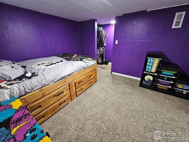 704 S 3rd Ave, Sterling, CO 80751 - bedroom featuring visible vents, baseboards, a closet, and light carpet