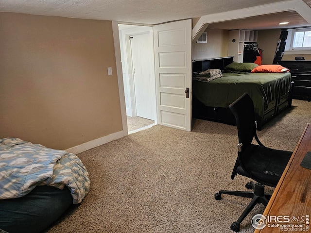704 S 3rd Ave, Sterling, CO 80751 - bedroom featuring baseboards, carpet flooring, and visible vents