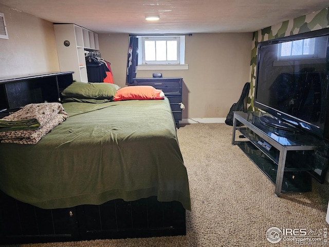 704 S 3rd Ave, Sterling, CO 80751 - carpeted bedroom featuring baseboards and visible vents