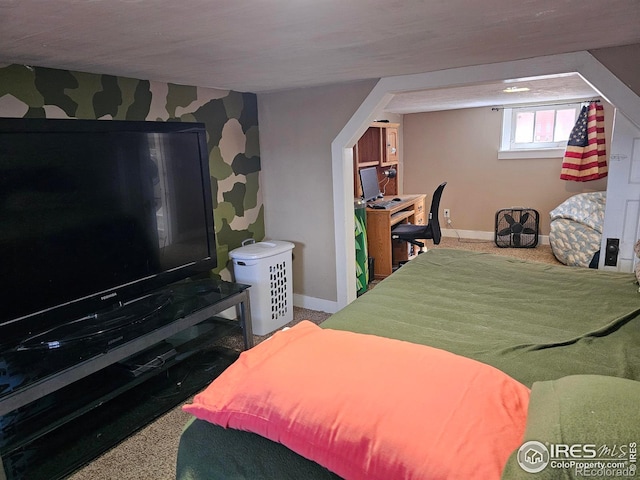 704 S 3rd Ave, Sterling, CO 80751 - bedroom with baseboards, carpet floors, and wallpapered walls