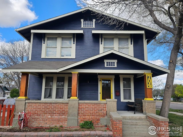 704 S 3rd Ave, Sterling, CO 80751 - view of front of house featuring a porch and brick siding