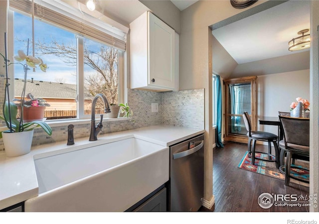 2821 5th St SW, Loveland, CO 80537 - kitchen featuring a sink, dark wood finished floors, backsplash, white cabinetry, and dishwasher