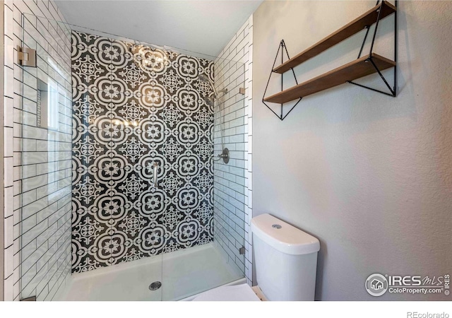 2821 5th St SW, Loveland, CO 80537 - bathroom featuring toilet and a tile shower