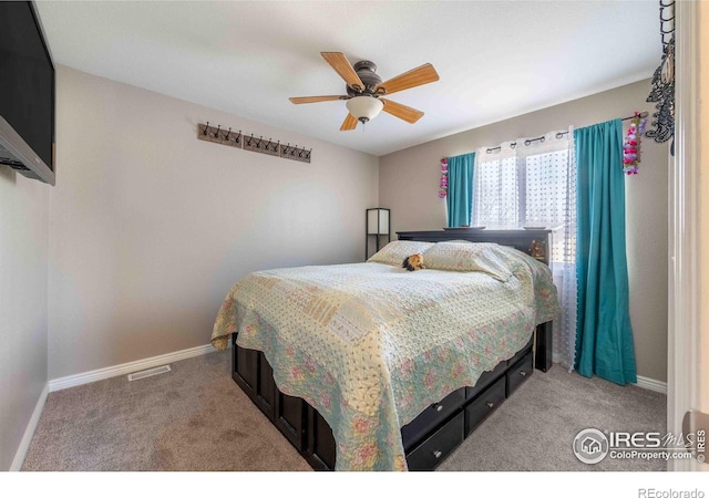 2821 5th St SW, Loveland, CO 80537 - bedroom featuring light colored carpet, baseboards, and a ceiling fan