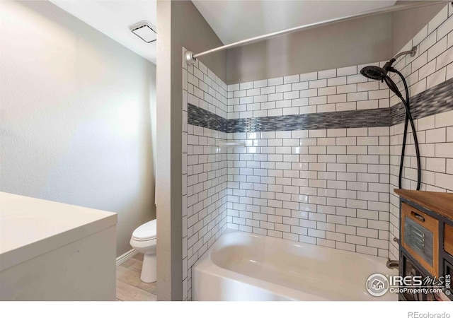 2821 5th St SW, Loveland, CO 80537 - bathroom with wood finished floors, vanity, shower / tub combination, toilet, and visible vents