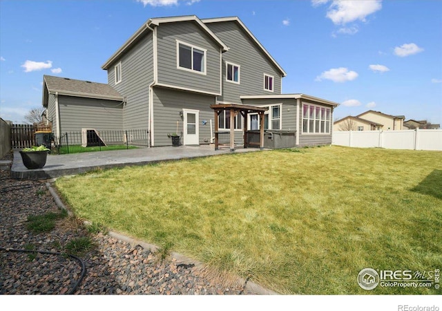 403 S Maple Ave, Eaton, CO 80615 - back of property with a patio area and a sunroom