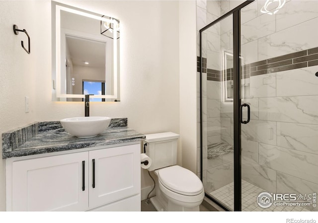 3364 Danzante Bay Ct, Berthoud, CO 80513 - full bathroom featuring toilet, a stall shower, and vanity
