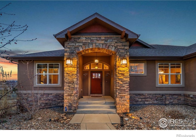1046 Greens Pl, Erie, CO 80516 - doorway to property with stone siding and stucco siding