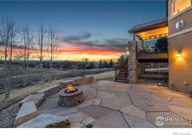 1046 Greens Pl, Erie, CO 80516 - view of patio / terrace with an outdoor fire pit and stairway