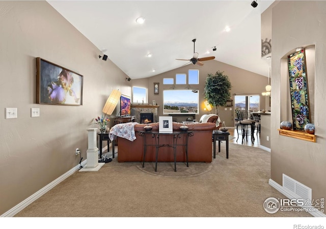 1046 Greens Pl, Erie, CO 80516 - office space featuring a ceiling fan, carpet flooring, baseboards, a lit fireplace, and high vaulted ceiling