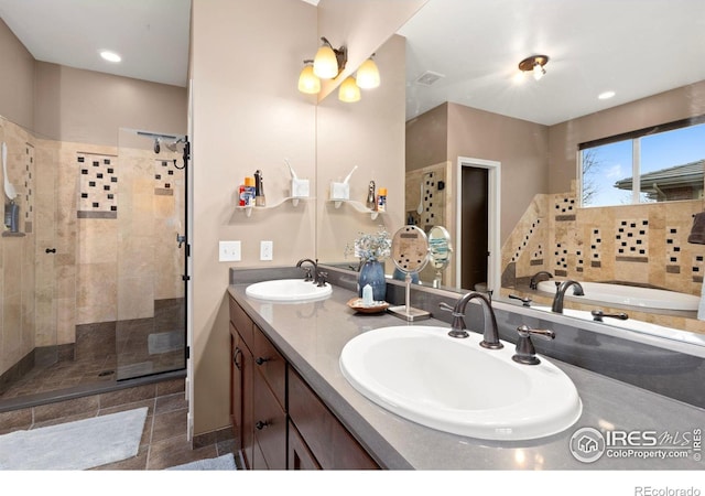 1046 Greens Pl, Erie, CO 80516 - full bath featuring a shower stall, double vanity, and a bathtub