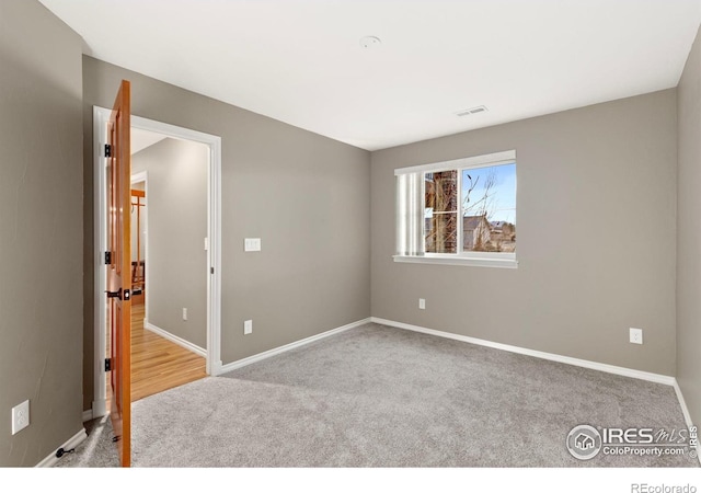 1046 Greens Pl, Erie, CO 80516 - carpeted spare room featuring baseboards