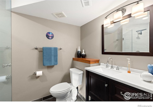 1046 Greens Pl, Erie, CO 80516 - bathroom with toilet, an enclosed shower, vanity, and baseboards