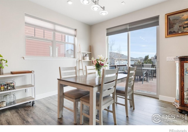 1863 Pioneer Cir, Lafayette, CO 80026 - dining area featuring wood finished floors and plenty of natural light