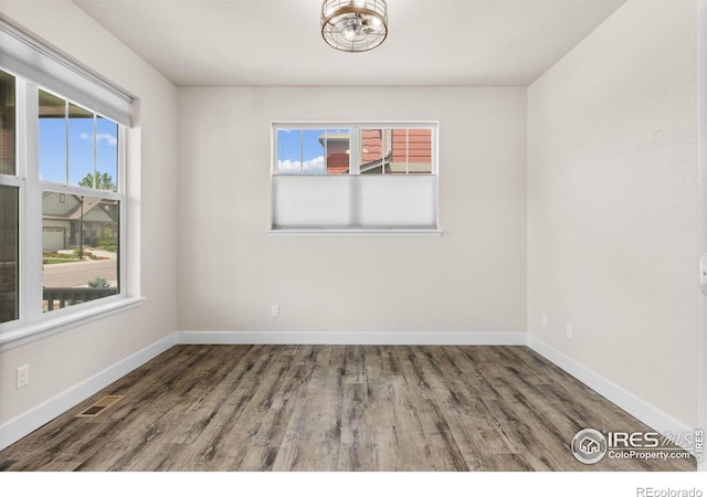 1863 Pioneer Cir, Lafayette, CO 80026 - unfurnished room with wood finished floors and a chandelier