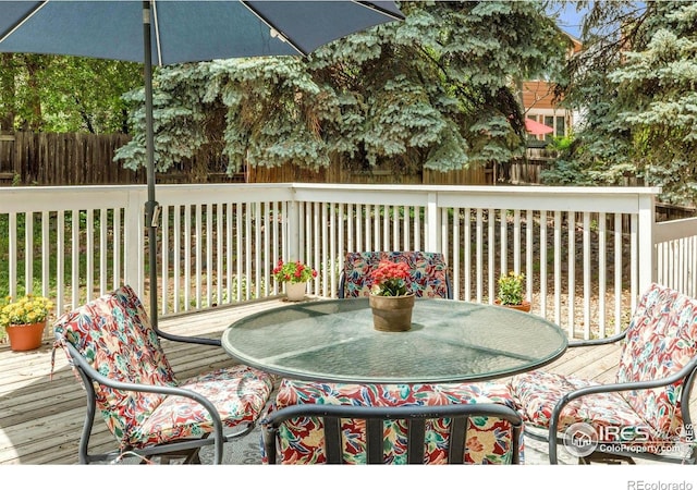 8940 W 80th Dr, Arvada, CO 80005 - deck featuring outdoor dining space