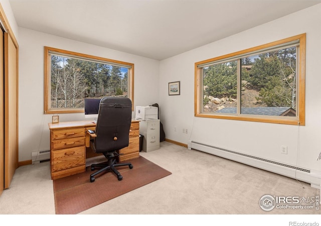 317 W 5th St, Nederland, CO 80466 - office area featuring a baseboard heating unit, light colored carpet, and healthy amount of natural light