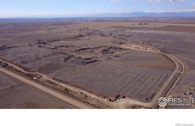 3113 County Road 17, Brighton, CO 80603 - drone / aerial view with a mountain view and a rural view