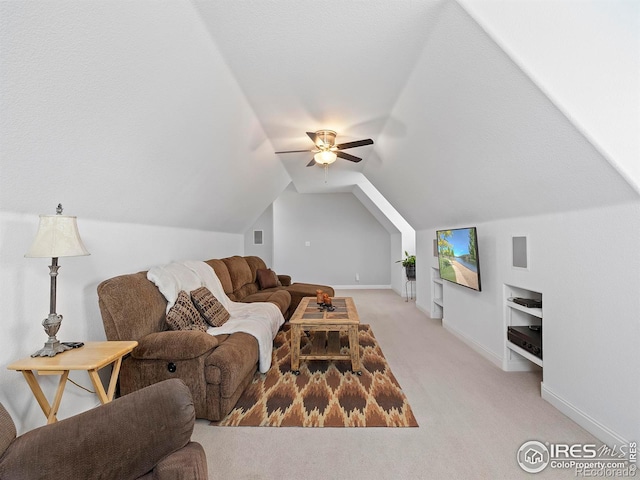 living area with vaulted ceiling, a ceiling fan, light carpet, baseboards, and visible vents