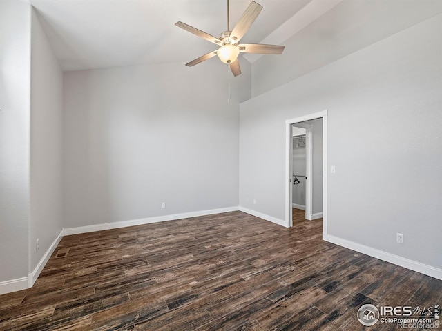 spare room with a ceiling fan, baseboards, and dark wood finished floors