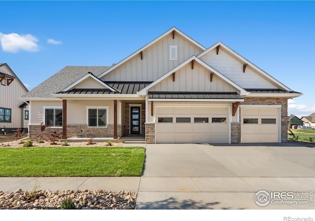 1402 Burt Ave, Berthoud, CO 80513 - view of front facade with an attached garage, a standing seam roof, concrete driveway, and a front yard