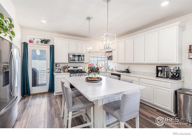 3536 Valleywood Ct, Johnstown, CO 80534 - kitchen featuring white cabinetry, appliances with stainless steel finishes, and dark wood-type flooring