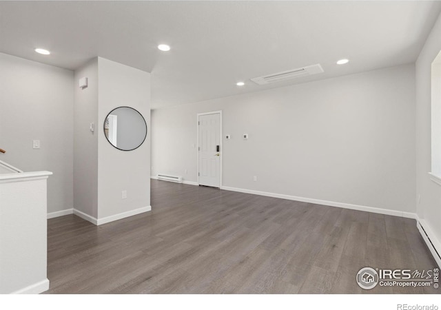 2836 Adobe Dr, Fort Collins, CO 80525 - empty room with a baseboard radiator, wood finished floors, baseboards, and recessed lighting