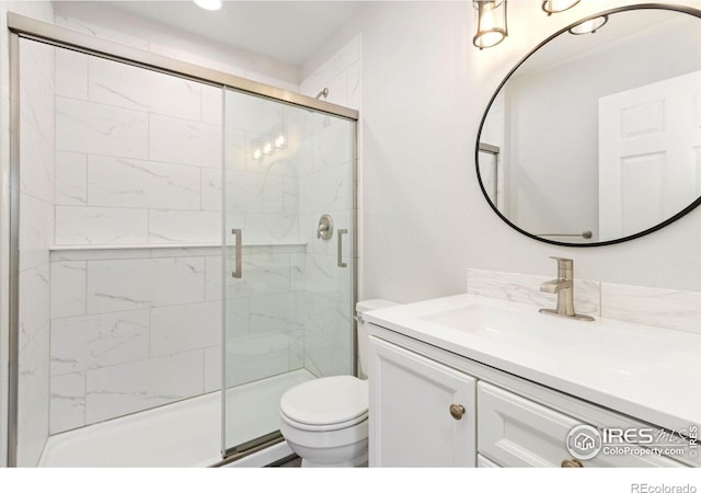2836 Adobe Dr, Fort Collins, CO 80525 - bathroom featuring a shower stall, toilet, and vanity