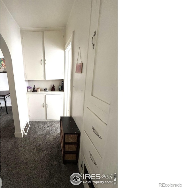 730 Lake St, Fort Morgan, CO 80701 - corridor with arched walkways and dark colored carpet
