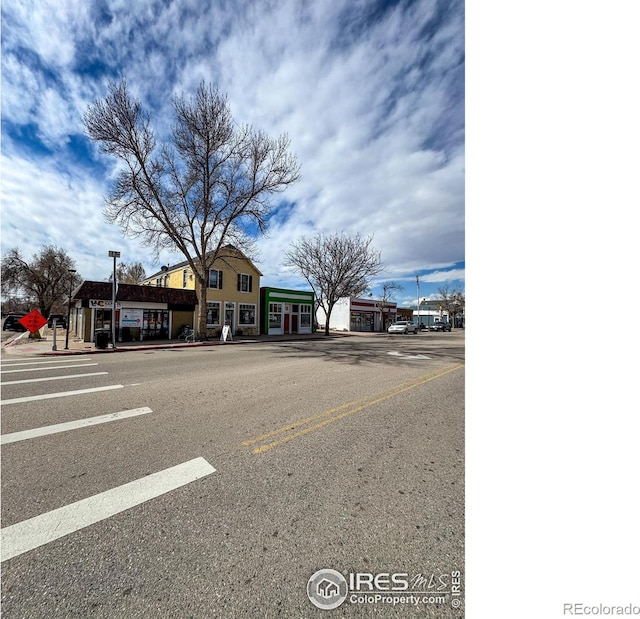 3828 Mckinley Ave, Wellington, CO 80549 - exterior space with sidewalks, street lights, and curbs
