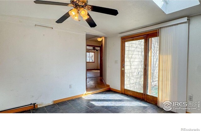 3828 Mckinley Ave, Wellington, CO 80549 - unfurnished room with a skylight, baseboards, and ceiling fan