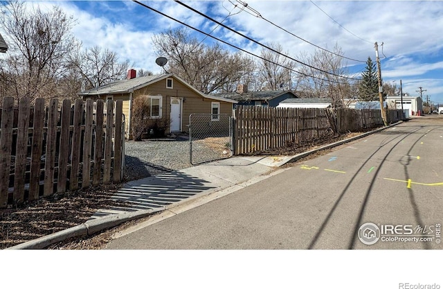 3828 Mckinley Ave, Wellington, CO 80549 - view of street featuring a gate and curbs